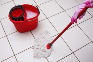 Mop and bucket mop and bucket on tiled floor